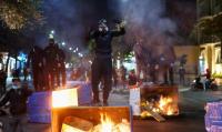 Albanians set fire to government buildings and clash with riot police in latest protests
