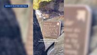 Historic hanging boulder falls at US tourist attraction