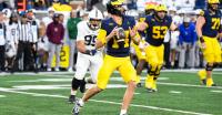 Michigan players praise QB Tommy Carr as film room junkie, vocal leader