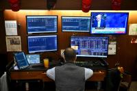 Wall Street rises as oil retreats, but AI jitters keep tech stocks in check