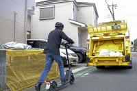 Japanese garbage collectors experimentally use e-scooters during work