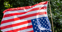 Nolte: Axios Uses Fake AI Image to Run Damage Control for Somali Politician Who Spoke Next to Upside-Down Flag