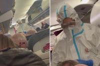 Medics in hazmat suits board plane as suspected norovirus makes passengers violently sick