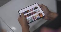 China's iQIYI streaming service adapts app for iPhone Duo, eyes AI cost cuts