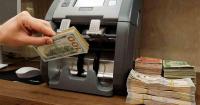 Dollar holds steady amid simmering Middle East tensions, rising oil prices