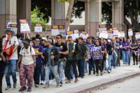 State workers picket in downtown LA during one-day strike over wages, health care and telework