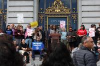 Politicians and organizers unite at City Hall to support immigrant service funding