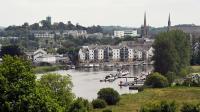 Bustling town in Northern Ireland with ancient castle, cosy pubs and its own magical island