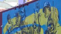 Artist paints new Brewers mural in downtown Milwaukee