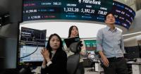 Asian shares slip as sharp drops for AI stocks overwhelm markets worldwide and oil prices jump