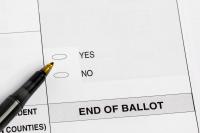 Massachusetts voters weigh ballot measure that could squeeze schools, housing, and health care