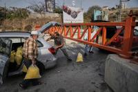 Israel imposes closures across a West Bank city after attacks, and other Mideast news