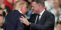 Audi CEO Gernot Döllner appears on stage with Trump at a Republican campaign rally to announce a new car factory in Georgia