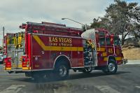East Las Vegas Mobile Home Fire Hospitalizes Two, Threatens Neighbor's House