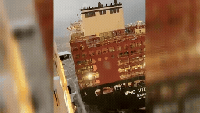 Cruise ship collides with container ship as strong winds batter German port