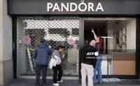 128 arrested as protesters loot shops, clash with police in Spain