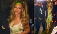 Beyonce stuns in a plunging gown as she and Jay-Z make a rare public appearance to celebrate 20 years of his champagne brand in Las Vegas