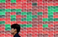 Asian tech stocks rally on Wall Street gains, but regional markets mixed