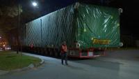 Why were two massive trucks heading to Eastman Business Park overnight?