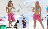 Swedish singer Zara Larsson shows off her bikini body at Cottesloe Beach in Perth alongside her boyfriend following sold-out Australian tour