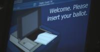 North Carolina voters weigh photo ID and tax cap amendments