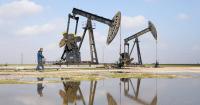 Oil falls almost $2 as Middle East talks help ease supply worries