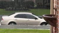 Texas storms wash out a water main, force 16 households out, and trigger a car rescue