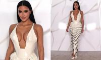 Kim Kardashian nearly spills out of racy dress at All's Fair premiere in Mexico… after revealing the true 'burden' of co-parenting with ex Kanye West