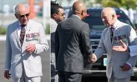 King Charles inspects guard of honour before throwing himself into carnival spirit in the Bahamas