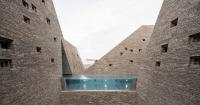 kengo kuma’s brick towers frame open-air pools at copenhagen’s upcoming bathhouse