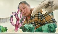 ASIA WATCH: Japanese recycling expert turns waste glass into Palau tourism success