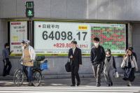 Asian markets mixed after uneven tech earnings, Fed holds rates