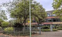 Teacher who went on sick leave for 16 years on full pay is charged with defrauding German college of hundreds of thousands of pounds