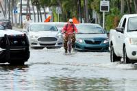 King tides flood coastal communities across US, disrupt traffic and inundate homes