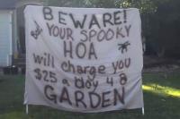 Georgia family puts HOA dispute on Halloween sign as $25-a-day garden fines pile up