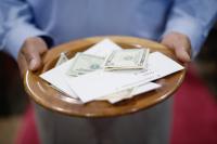 Priest pleads guilty to stealing $160K from Catholic church in Kansas