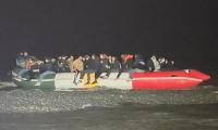 'The gangs are laughing at us': Channel migrants board 'custom-made' small boat in colours of the Kurdish flag, as Belgian police stand and watch