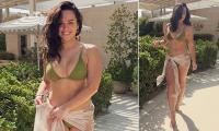 Georgia May Foote poses in a skimpy green bikini during Dubai getaway - after revealing new relationship following split from husband Kris Evans