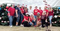 Community volunteers give Branson’s Community Christmas Tree a patriotic new look