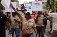 Trade union members raise their voices during PoS march