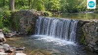 A Pennsylvania landowner’s 7-foot stone dam was built as a swimming hole; removal aimed to improve Smithtown Creek’s water quality and fish habitat