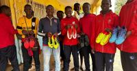 Elliot returns with football boots appeal after helping children in Africa